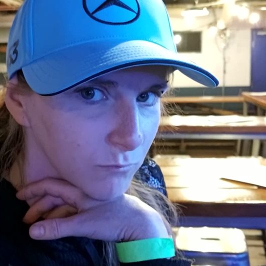 A fan in a Mercedes cap